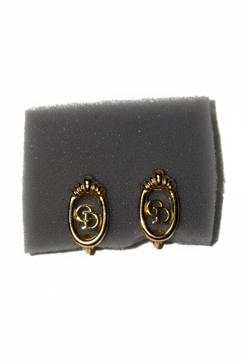 Boucles d'oreilles Dior logo en métal doré